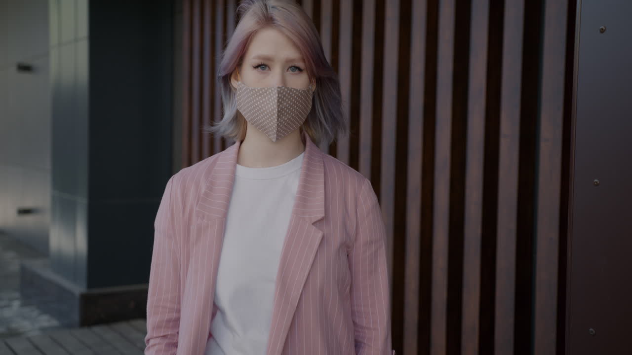 Woman Wearing a Face Mask in a Pink Blazer