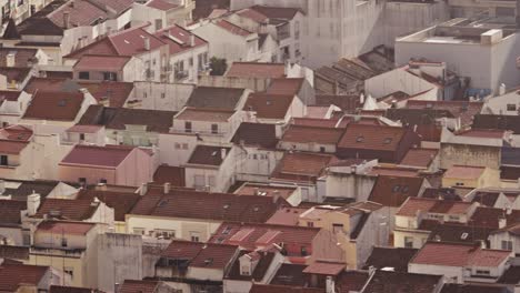 Full-screen-of-houses-rooftops-of-Nazare-city-or-village-in-Portugal,-top-telephoto-lens-view