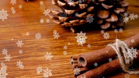 animación de la nieve cayendo sobre las decoraciones de navidad en la mesa