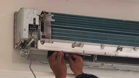 air conditioner repair in progress