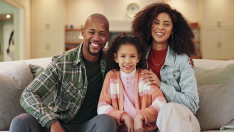 a happy family portrait on the couch at home
