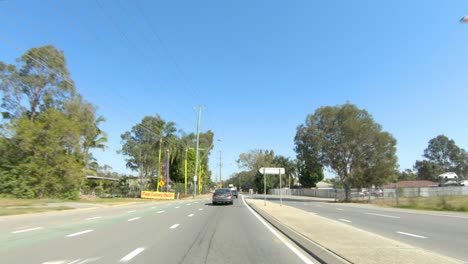front facing driving point of view pov of quiet australian country roads - ideal for interior car scene green screen replacement