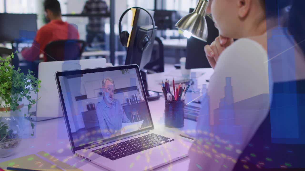 In modern office, person working at desk with animation of video call overlay