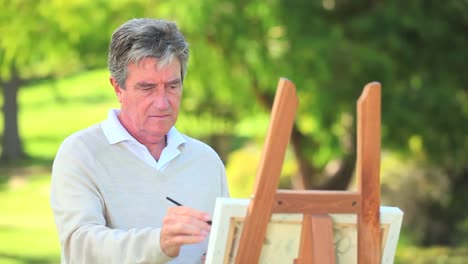 Mature-man-painting