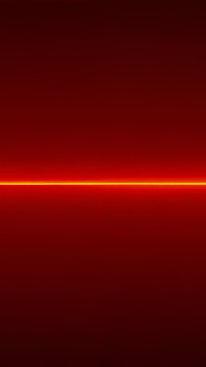 Vertical video: Audio beat sparking amber wave halo on deep red, pulsing center shifting settling