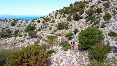hiking a rocky mountain trail with a stunning sea view