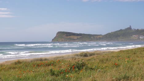 Picturesque Landscape Of Lennox Point With Blue Sky In The Background - Blue Ocean Waves Washing Up On The Beach - Lennox Head, New South Wales, Australia