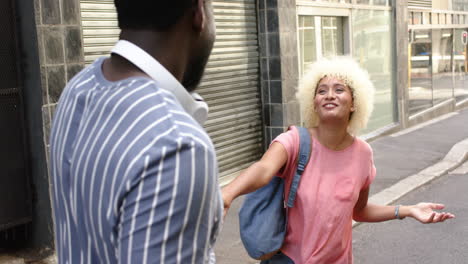 a diverse couple shares joyful moment on a city street