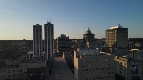 aerial-of-downtown-Peoria,-Illinois-at-sunset