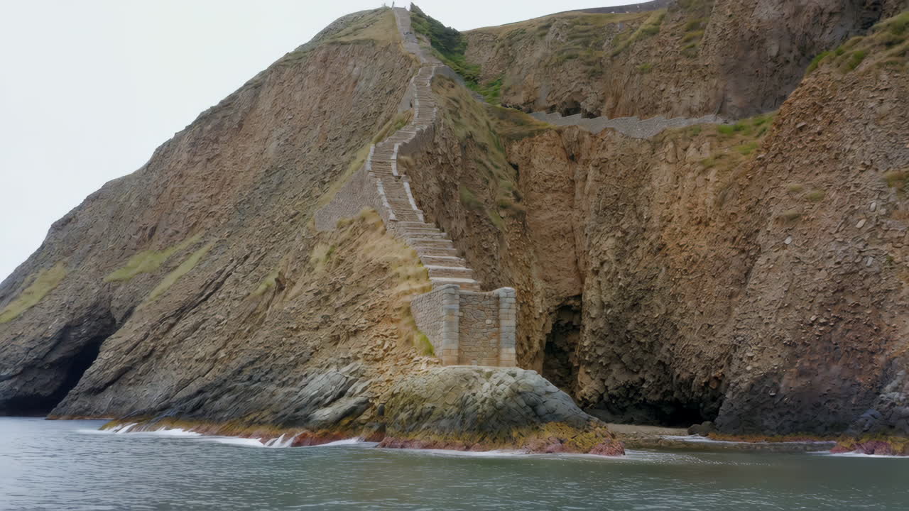 Stone Staircase Winding Up a Steep Coastal Cliff