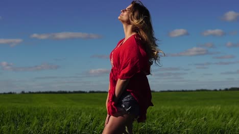 woman in a red shirt in a field