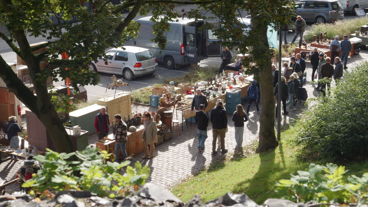 People Strolling on the Antiques Market in Tongeren on a Sunny Day