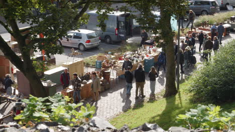 people strolling on the antiques market in tongeren on a sunny day