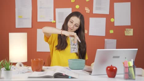 positive girl child saving money in piggy bank.