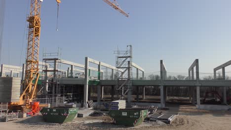 a huge company building is erected on a large construction site