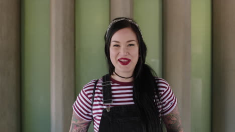 portrait of beautiful young woman smiling confident wearing stripe shirt