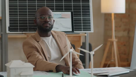 portrait of african american renewable energy engineer at work