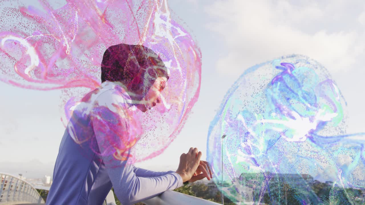Woman in hijab tapping phone, using fitness app, starting pink blue orbs expanding overlapping city