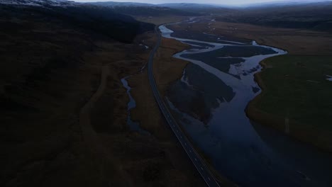 aerial view of valley road in beautiful iceland landscape, dark and moody