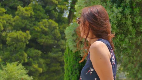 detail of beautiful woman with sunglasses enjoying a sunny day