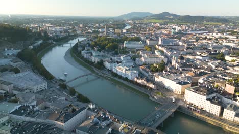 salzach river and mirabell palace in salzburg, austria - beautiful drone flight