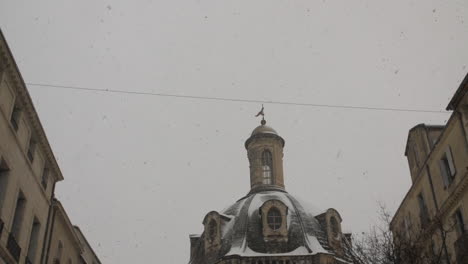 up to down tilt on saint come hotel in montpellier france. snowy day winter slow