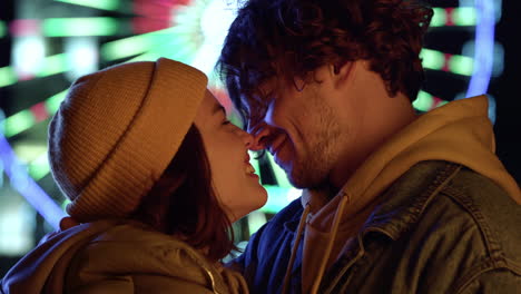 Lovely-couple-rubbing-noses-outdoor.-Man-and-woman-felling-happy-on-city-street.