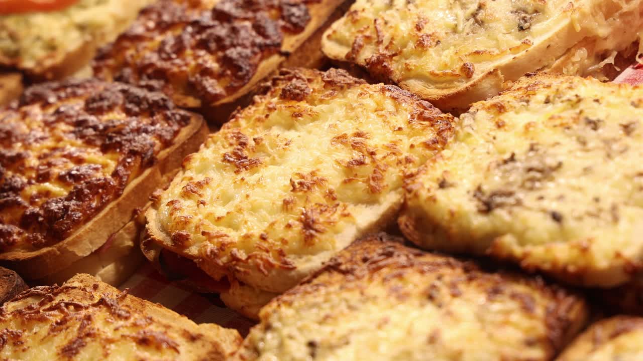 Pizza bread slices with cheese toppings for sale at the market, fast street food