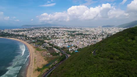 aerial drone shot of vizag city, showcasing its bustling streets and coastal beauty under a clear sky.