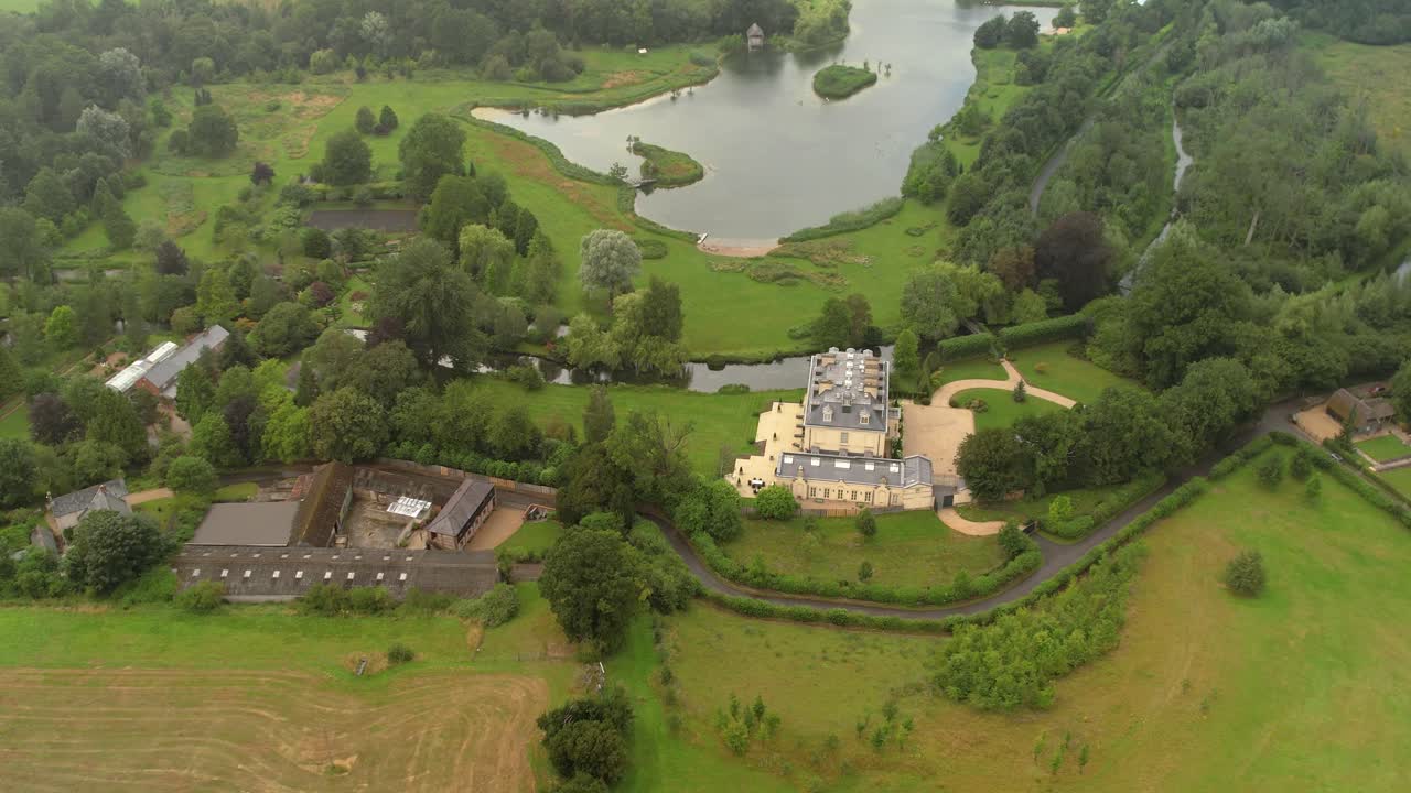 Establishing aerial view circling above Kenwood house estate and gardens in Hampstead Heath London