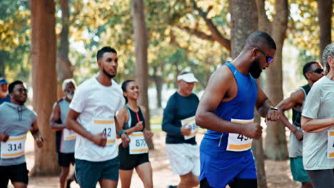 group of people running a marathon in a park