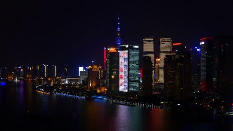 night illuminated shanghai cityscape downtown rooftop riverside panorama 4k china