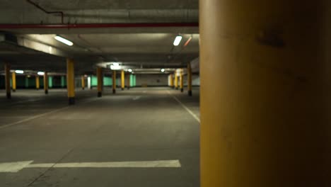 empty underground car park at night, no vehicle in spots in the parking lot