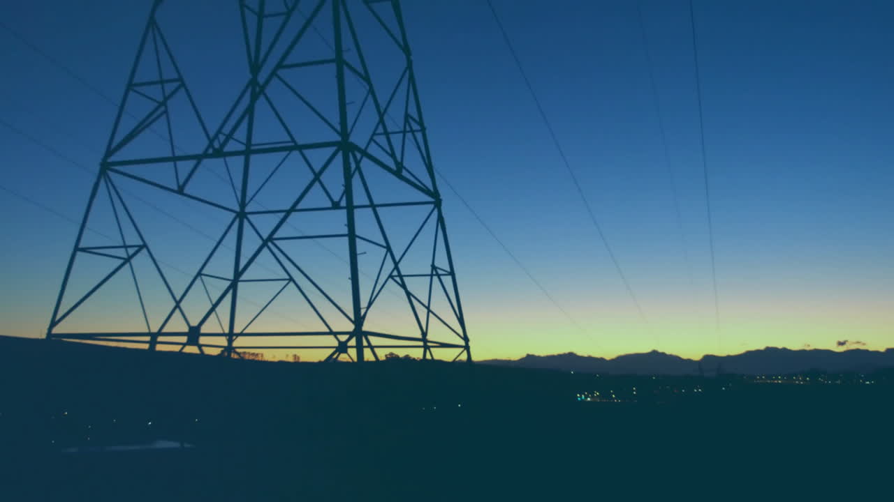 Line graph with red data points animation over power lines at sunset