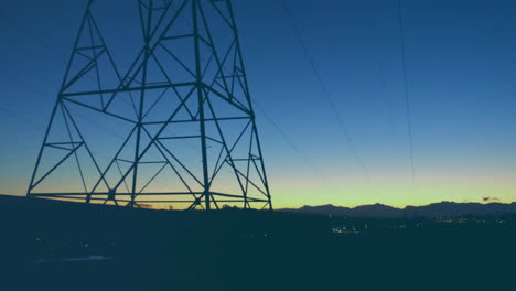 line graph with red data points animation over power lines at sunset