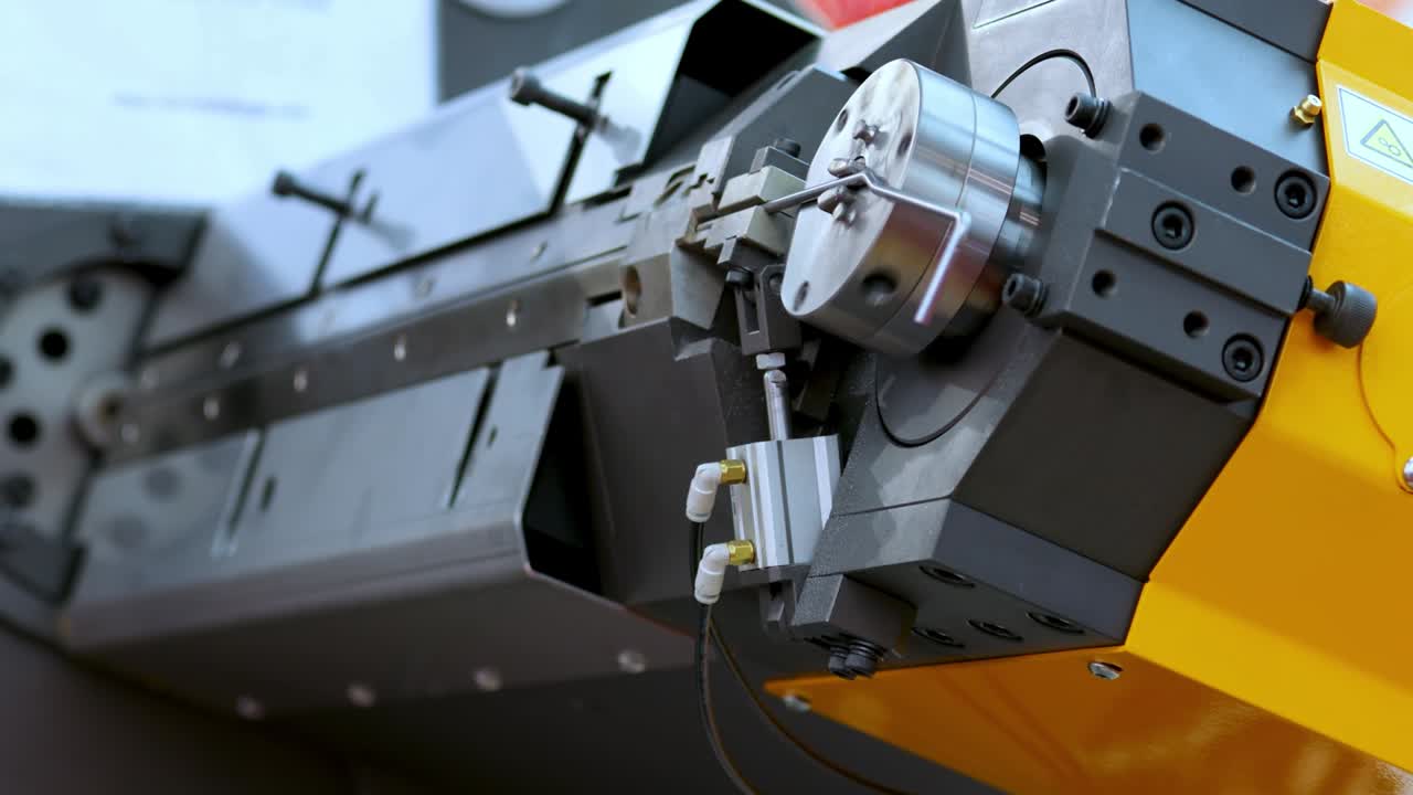 Wire bending machine. CNC metal processing. Automated metalworking machine.