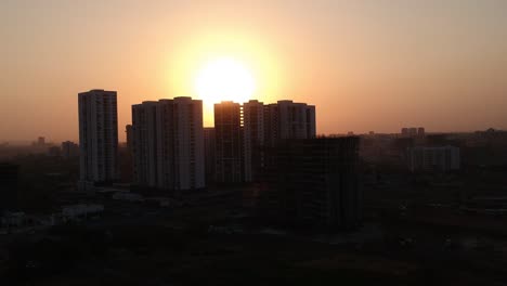 aerial footage shot in a growing indian city showcasing architectural buildings as well as new residential apartments