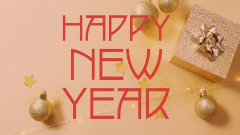 animation of happy new year text banner over christmas decorations and gifts on pink background