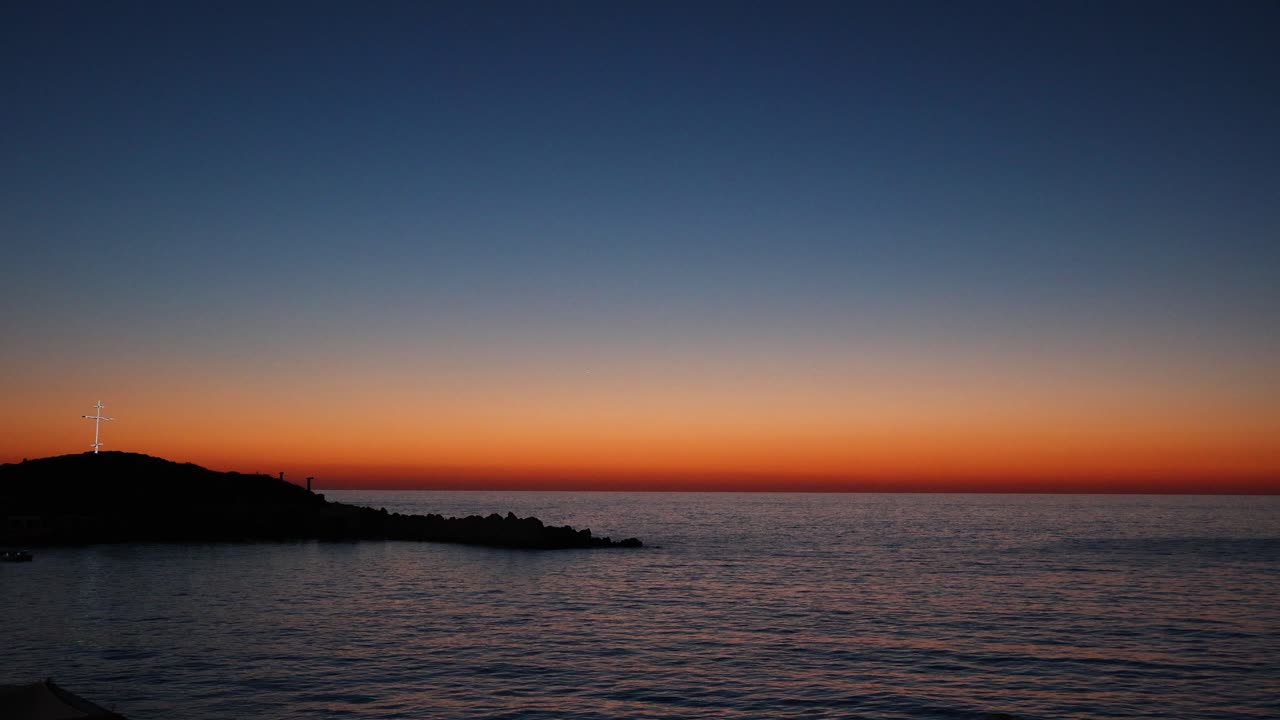 Christian Cross on Lebanon Coast with Beautiful Mediterranean Sunset