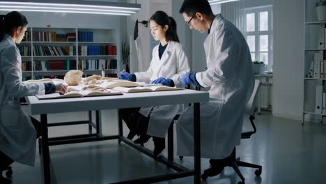 scientists examining anatomical specimens in a laboratory