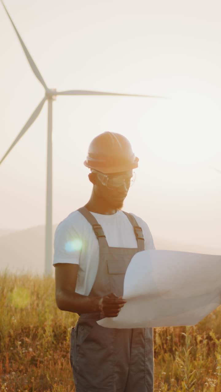 Engineer inspecting wind turbine plans