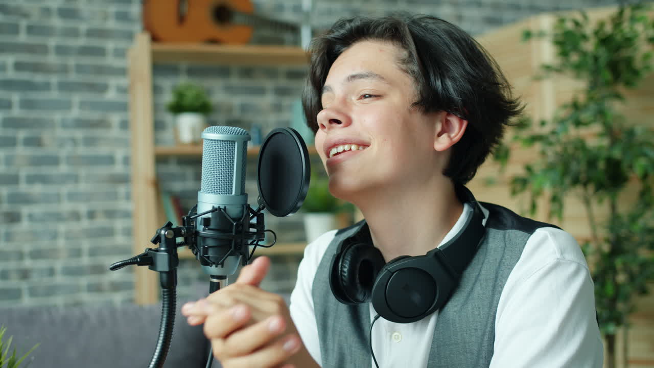 Teenager Singing into a Microphone in Home Studio