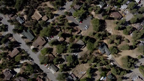 a drone shot flying over the suburbs in big bear, san bernardino county, california