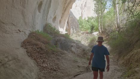 female hiker explores rose valley trail cappadoccia landscape