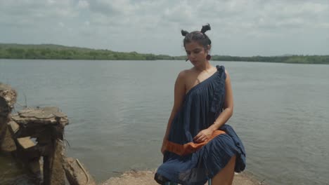 woman-sits-with-a-contemplative-expression,-her-eyes-focused-on-the-environmental-challenges-that-lie-ahead