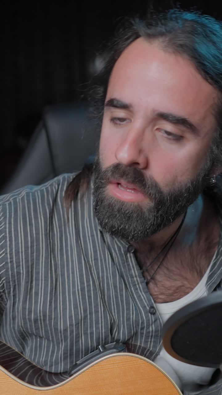 Musician with Acoustic Guitar and Microphone Singing