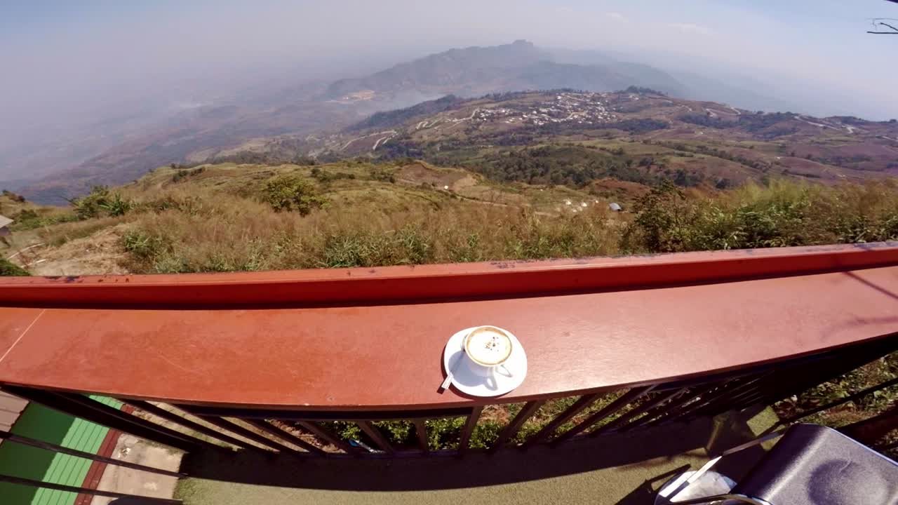 coffee in a cup kept at Hill top coffee shop at view point balcony, Phu Thap Boek,Phetchabun, Thailand