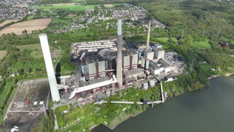 aerial view of a large power plant by a river