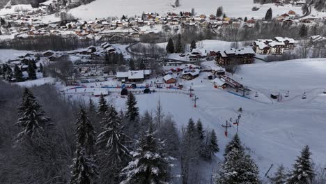 Circular-view-of-ski-station-in-winter-with-pines-and-snow,-Bernex,-French-Alps