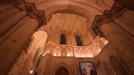 low angle cinematic shot capturing painted windows of saint-nicolas church in blois, france. big, tall pilars.